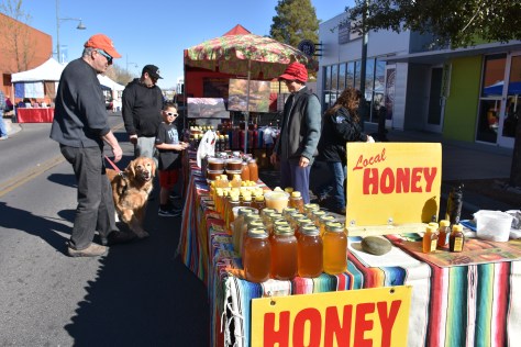 selling honey at Las Cruces Farmers Market www.offthebeatenpagetravel.com